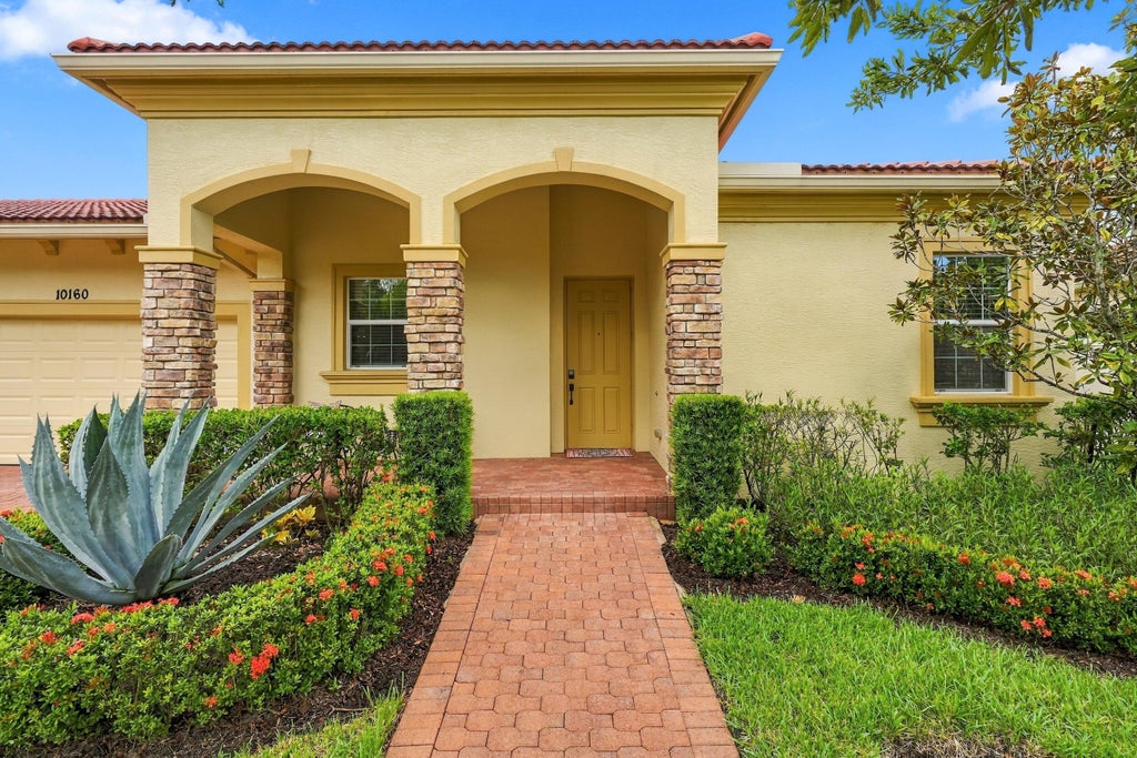Photo of 10160 SW AZZO Lane, Port Saint Lucie, FL 34986 (MLS # B26080421)
