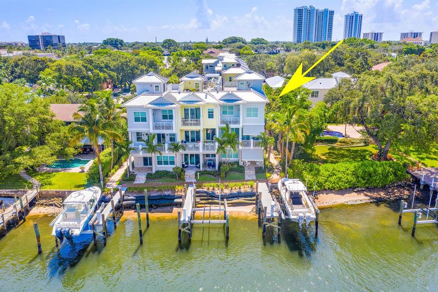 2019 built, Direct Intracoastal Waterway 3brm 41/2 Townhome with dock for 40'-foot boat, 10 feet out your back door. Shows like a model. Incredible panoramic water views from all four levels. Here is a chance to have a slice of paradise with 3418 square feet of living area, accessed by all glass elevator in addition to Chrome rail wide wood staircase. This home is loaded with custom upgrades featuring all impact glass sliding doors and windows, gorgeous kitchen with quartz counter tops and mother of pearl back splash, 3 A/C zones, security system w/cameras, control 4 smart home system, Sonos sound, new full house generator, retractable electric awnings and plantation shutters throughout. Plus, private rooftop party area with refrigerator, sink and fantastic water and night views.