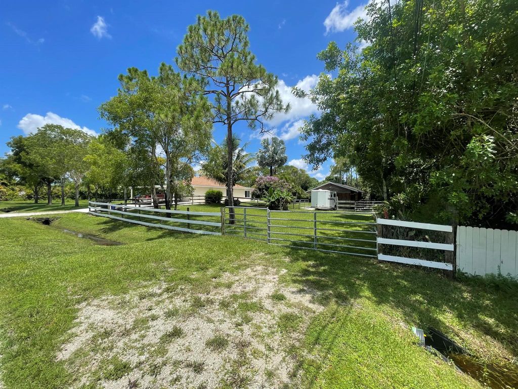 Photo of 14231 83rd Lane N, Loxahatchee, FL 33470 (MLS # R10939049)
