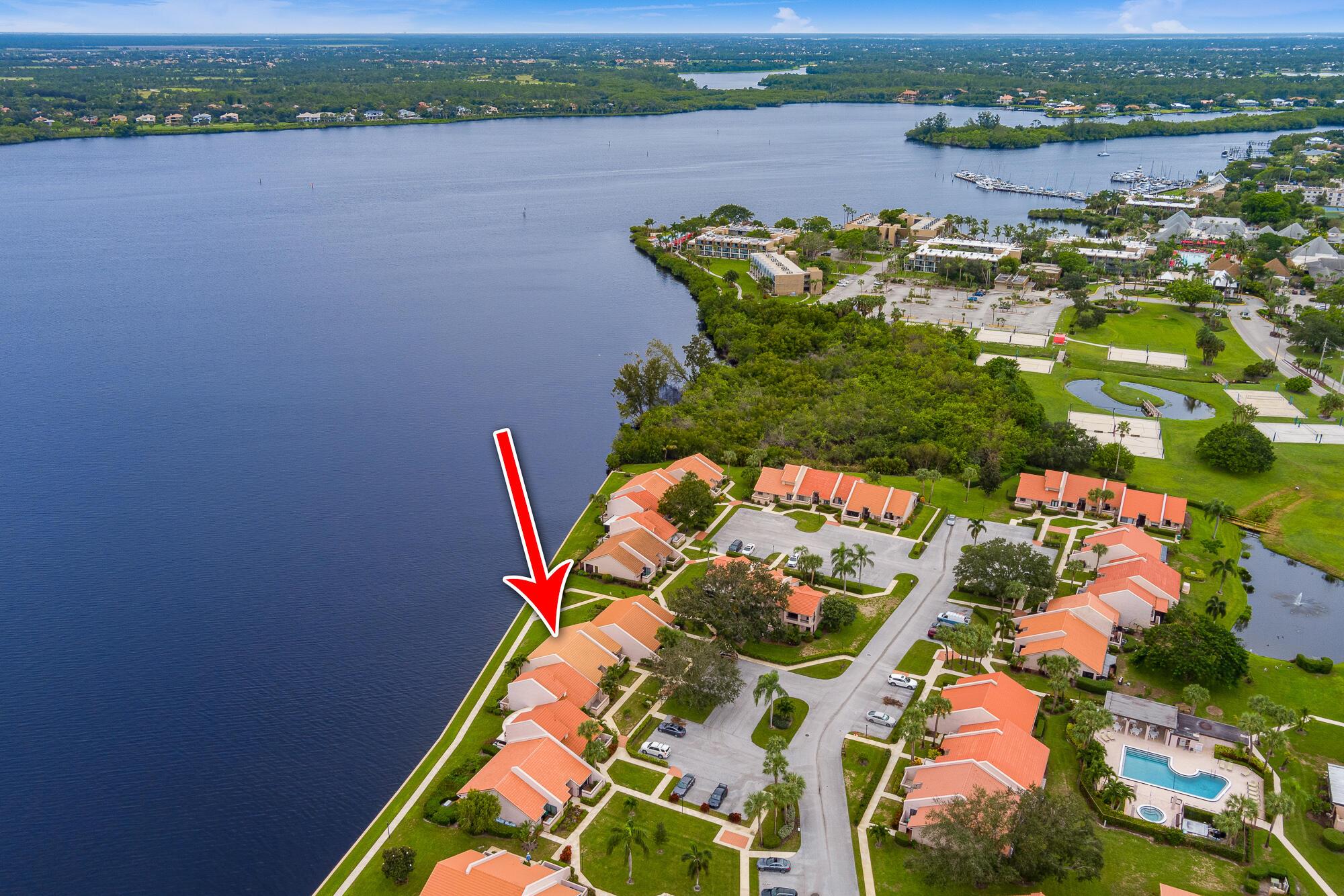 DIRECT WATERFRONT Villa with spectacular river views (Per FEMA flood map, flood insurance is not required!!). 3 Bedrooms with 3 full baths and two master suits! New roof in 2018. Impact glass windows and doors in 2016 (except front door and sidelight). Renovated with newer flooring, newer kitchen, newer water heater and brand ew electrical panel and A/C. Community offers pool/spa, community dock & gazebo. When you walk in the door you will be impressed with the cathedral ceilings and then there is that view!