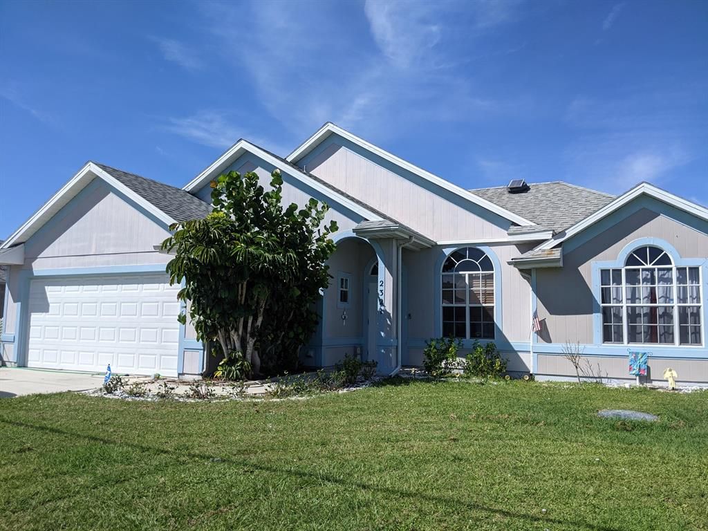 Photo of 2321 SE Calcutta Circle Cir, Port St Lucie, FL 34952 (MLS # R10751881)