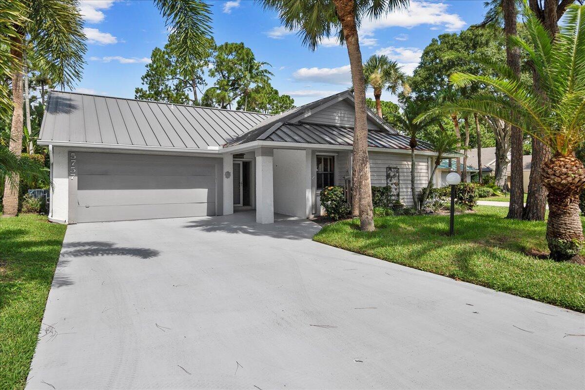 Incredible opportunity in one of the most desirable neighborhoods in Jupiter! This lovely 3-bed, 2-bath pool home offers the ideal blend of comfort, style, and Florida living. CBS with metal roof (2022), this home will provide peace of mind for years to come. A/C replaced in 2018, adds to the home's value and efficiency. Nestled on a quiet street the property offers both privacy and a sense of community. Step inside to find an open, spacious floor plan that's ideal for everyday living and entertaining. The vaulted ceiling entry enhances the airy feel, while the living room opens seamlessly connecting your indoor space to the expanded family room, screen enclosed pool and spa area--perfect for enjoying the Florida sunshine year-round.