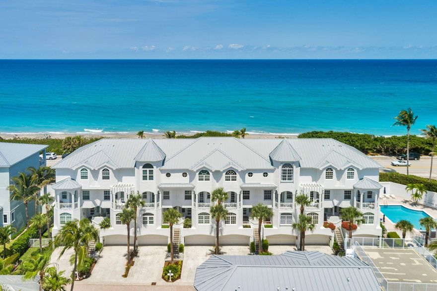Enjoy panoramic beach and ocean views from this bright and spacious 4-bedroom, 4-bath townhouse in the exclusive, gated community of Jupiter Key. Offering over 3,200 square feet of luxurious living space, this coastal retreat combines elegance, comfort, and convenience just steps from the sand. Inside, you'll find a gourmet kitchen with rich cherry cabinetry, premium appliances, and hardwood floors throughout the main living areas. The expansive master suite features a spa-like ensuite bath and private patio access, perfect for morning coffee with an ocean breeze. Additional highlights include an in-unit elevator, double-car garage, two brand-new Trane AC units, and a fire protection sprinkler system for peace of mind. With four outdoor patios and access to a stunning beachfrontcommuni