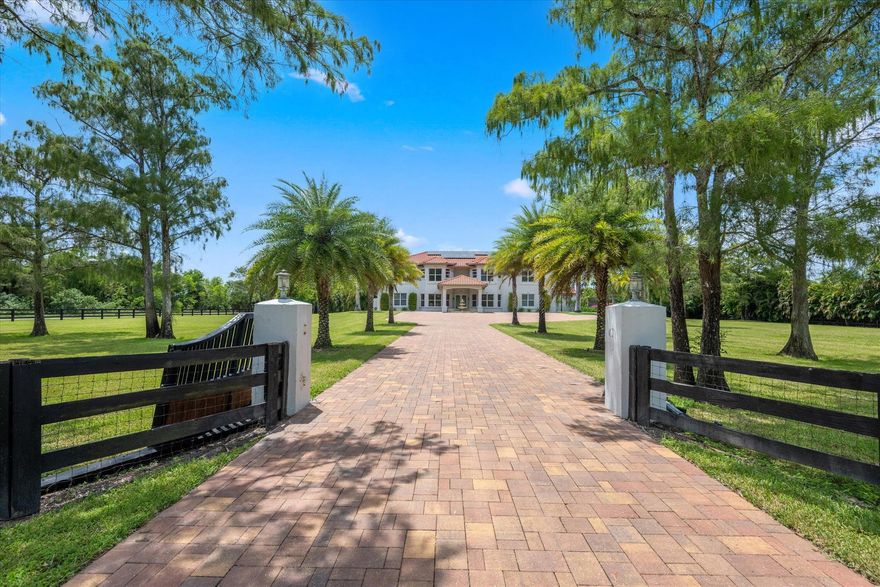 The ultimate resort style home with large a/c hangar for extensive ''toy'' storage: Built in 2,000 and set on 5 acres in gated Deer Run, this 5BR/5BA grand estate blends luxury with function. Re-roofed 2018, full impact glass, solar panels (2023), and new HVAC (2024) ensure efficiency. New flooring and recent renovations. The remodeled saltwater pool has spa, waterfalls, LED lighting, propane heater, UV system, and app controls. Enjoy sunsets with an outdoor kitchen, tiki hut, and firepit. The remodeled primary suite features marble spa bath and custom closets. A detached 3,348sf air-conditioned garage (2020) with insulated roof, 3 oversized doors, separate power, and 12,000sf hardstand offers endless potential. Fully irrigated and fenced with room for equestrian facilities SEE SUPPLEMENT