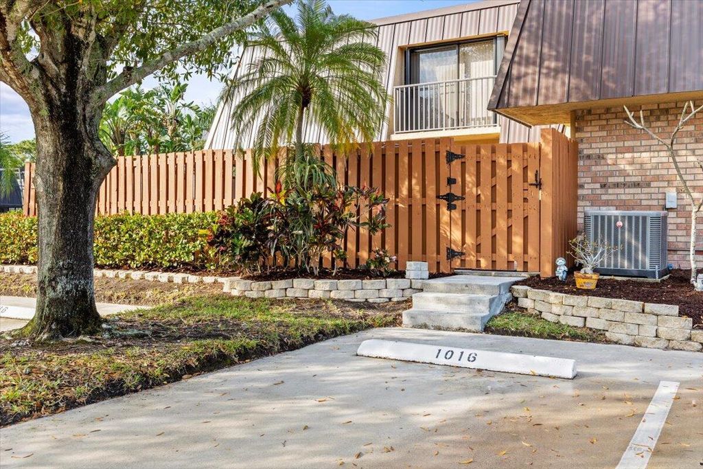 Photo of 6121 SE Windsong Lane #1016, Stuart, FL 34997 (MLS # R10955626)