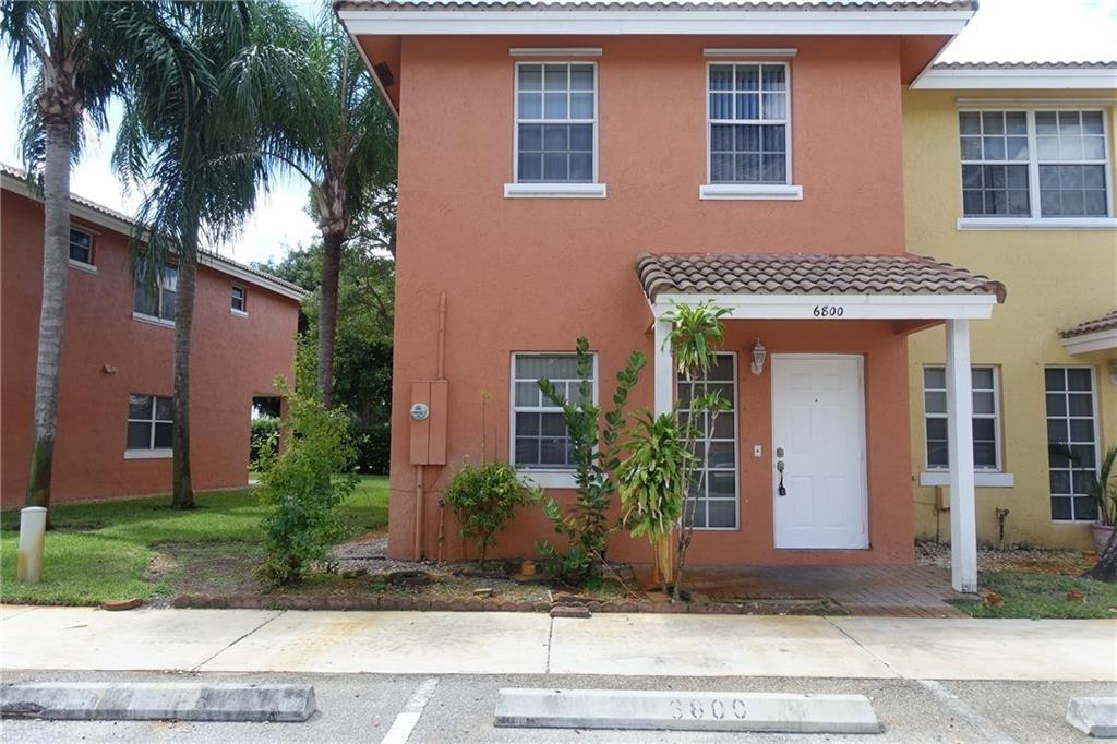 Corner!! Spectacular three-bedroom, Two-and-a-half-bathroom townhouse is located in the heart of Lauderhill!! It has a Stunning Golf course view. The living area has tile, and the bedrooms have wood flooring. This lovely home features a newly renovated kitchen, complete with white cabinets, a New granite countertop, a New dishwasher, a range, and a New microwave. Tile flooring is throughout the entry-level, and laminate flooring is on the second level. It has been freshly painted. New AC and Water Heater. It is in immaculate condition. Enjoy your privacy. No neighbor behind. It is within walking distance of a workshop.
