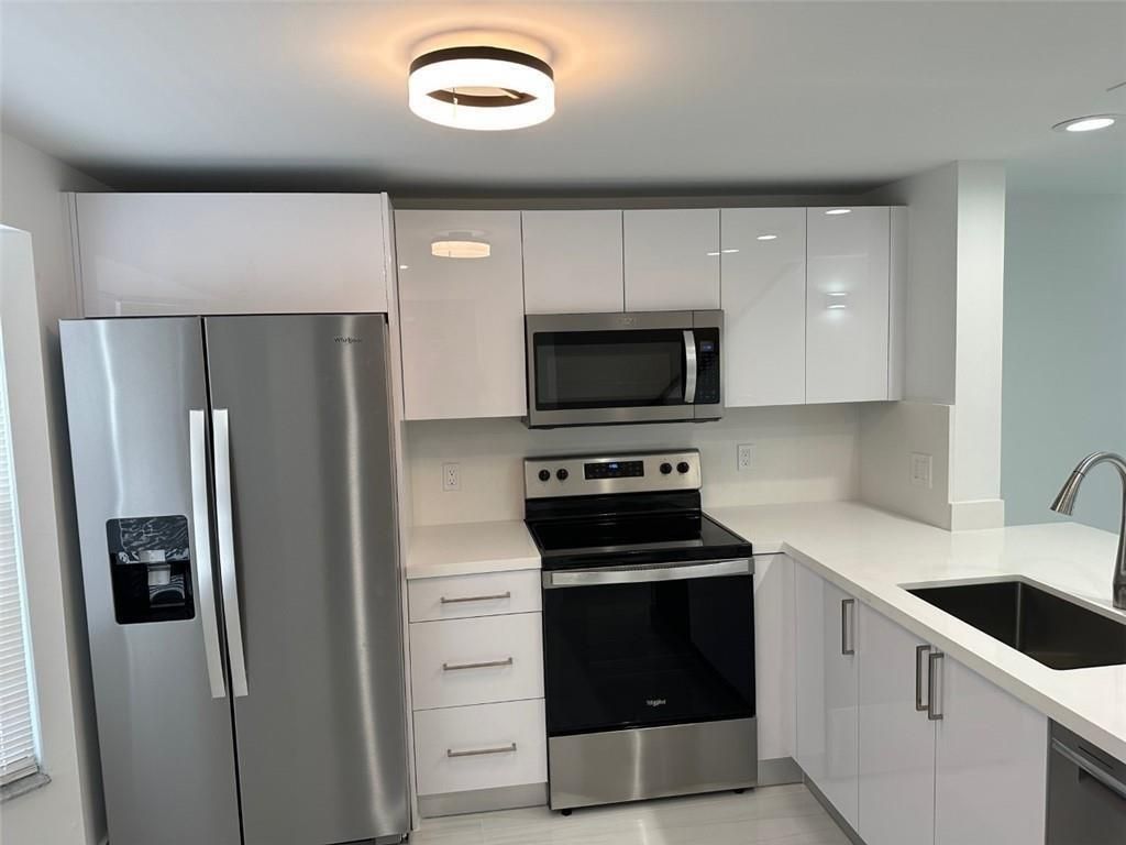 Photo of 972 Jeffery Street, Boca Raton, FL 33487 (MLS # B26021534)