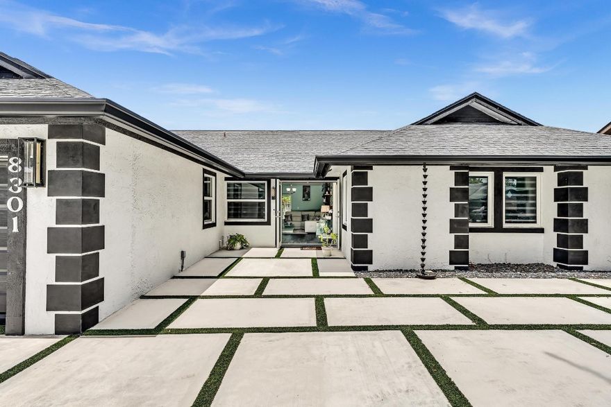 * One of a kind* Spectacular* Dream Home* This lovely three-bedroom two-bathroom *HAS IT All* As soon as you walk into this unique home, you feel welcomed, offering a NEW, open white kit. with quartz countertops overlooking the family room. Top-of-the-line stainless steel appliances. New stunning porcelain flooring throughout your entire home. NEW modern bathrooms. NEW light fixtures. NEW best quality impact windows and all the sliding doors, including a garage door. NEW vinyl flooring in the garage. New patio marble flooring, Fenced a backyard to keep you relaxing & enjoying the privacy. The driveway is extended to accommodate parking for six cars, featuring New artificial grass & a Concrete Paver Driveway with new lighting around the parking area. Immaculate! Close to school, shopping