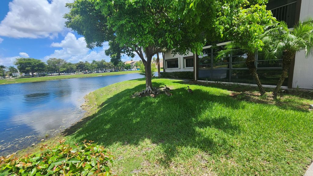 Photo of 9935 N Belfort Circle, Tamarac, FL 33321 (MLS # B26032444)