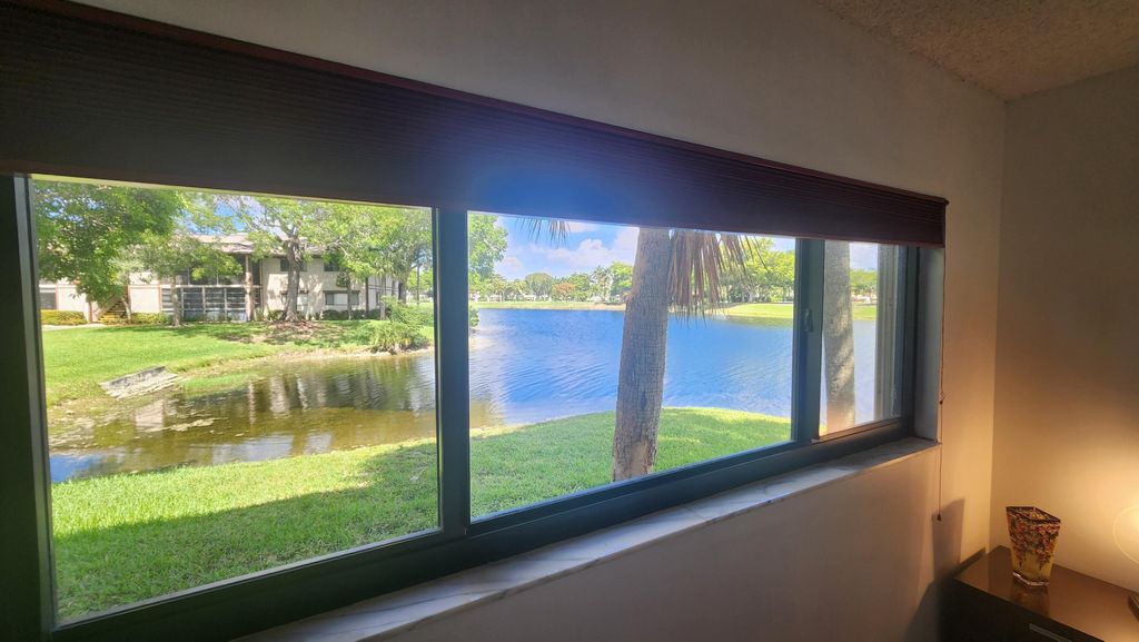 Photo of 9935 N Belfort Circle, Tamarac, FL 33321 (MLS # B26032444)