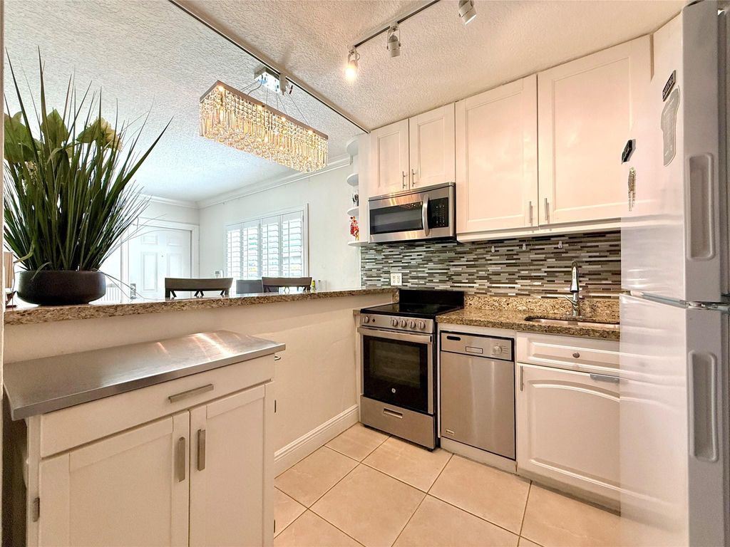 Photo of 2124 NE 5th Ave #101, Wilton Manors, FL 33305 (MLS # F10533634)
