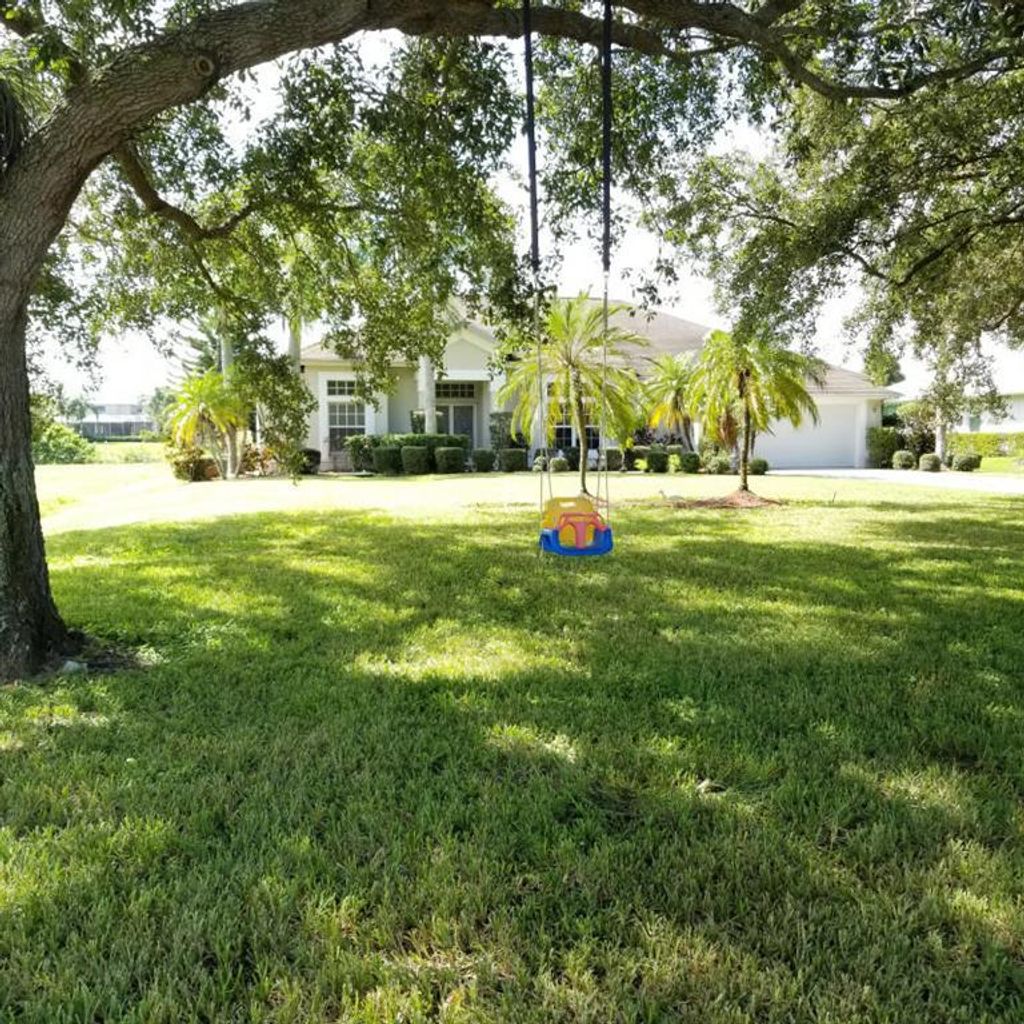 Photo of 2604 SW River Shore Drive, Port Saint Lucie, FL 34984 (MLS # R10656476)