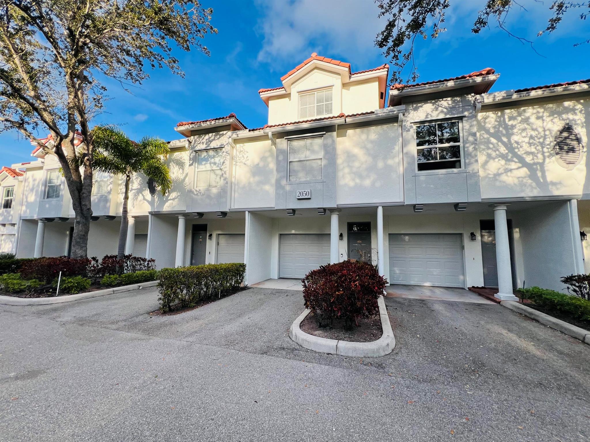 This 2-bedroom townhouse-style condo in the sought-after Tierra Verde community offers the perfect blend of comfort and convenience. Both master suites feature spacious walk-in closets, one with a queen bed and the other with a king bed (convertible to twins), and come fully stocked with linens and towels. The two full bathrooms include one with a luxurious soaking tub. The living room is outfitted with a new La-Z-Boy reclining sofa, while the fully equipped kitchen has everything you need, from dishes and flatware to a Keurig, coffee pot, kettle, crockpot, and blender. Step outside to the balcony patio, complete with two Adirondack chairs, or take advantage of the in-unit washer/dryer and private garage. Delray Beach Rental!
