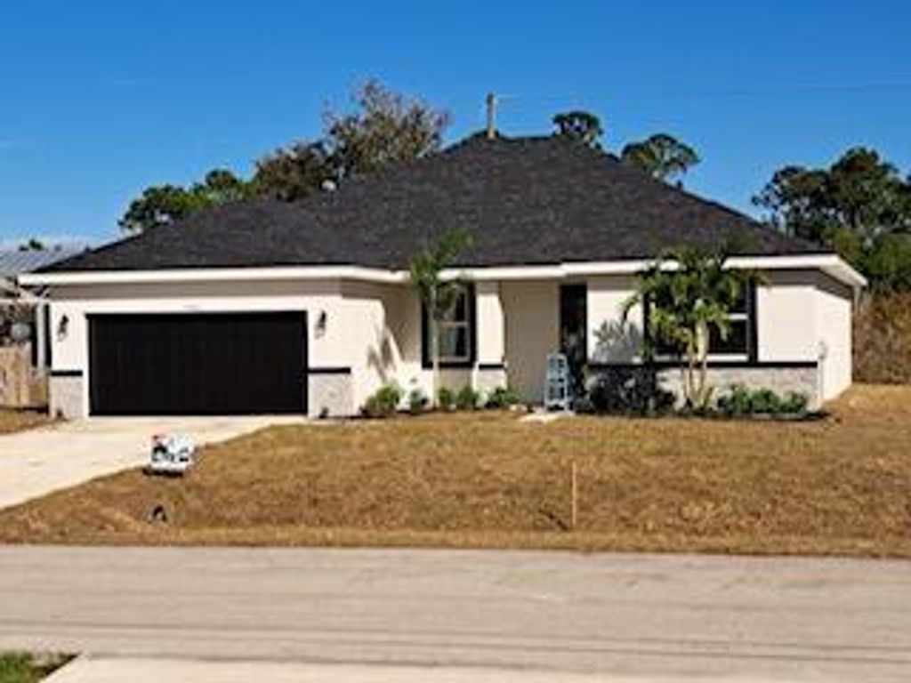 Photo of 402 SW Naftal Road, Port St Lucie, FL 34953 (MLS # R10889381)