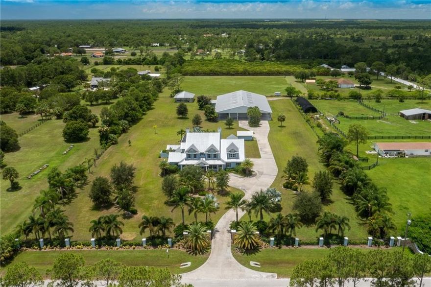 *BARN/WAREHOUSE BEING TORN DOWN. Photos previously taken before damage.* Palm City Farms Estate Home on 5 Acres! Brand New and NEVER LIVED IN! Bring the entire family and the Horses to this Large 5 ( Possible 6) Bedroom home with 6000 square feet under air! Built in 2007 but never lived in, this home is perfect for a large family wanting not only a large home but acreage. Just the cost to build the house in todays market far exceeds the listing price WITHOUT THE LAND! Don't miss your opportunity to capitalize on a great property. A rated Schools for the kids.
