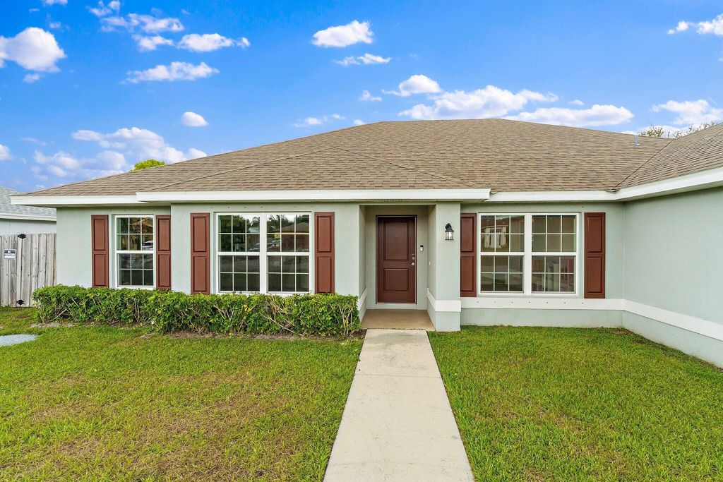 Photo of 517 SW Cherryhill Road, Port Saint Lucie, FL 34953 (MLS # R11122390)