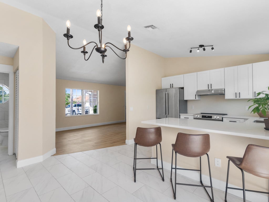 Photo of 466 SW Dauphin Avenue, Port Saint Lucie, FL 34953 (MLS # R10974060)
