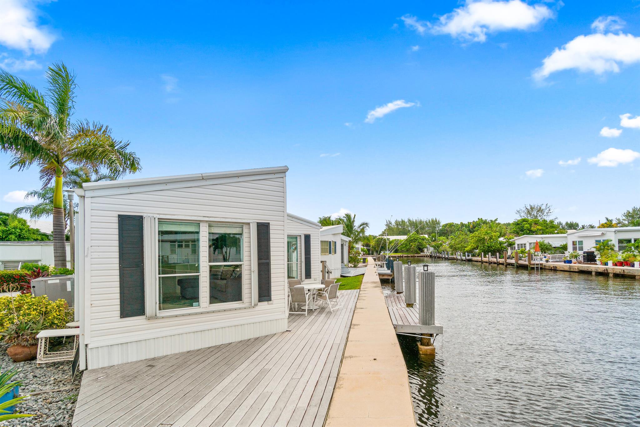 Offered for sale with 46 shares in the Briny Breezes Cooperative, this spacious 2-bedroom, 2-bath home offers panoramic water views from nearly every angle. Nestled in one of the most coveted locations in the community, this unit combines comfort and coastal charm with generous interior living space, perfect for year-round living or a seasonal retreat. Don't miss your chance to experience the Briny lifestyle--complete with private beach access and resort-style amenities. Schedule your private showing today!