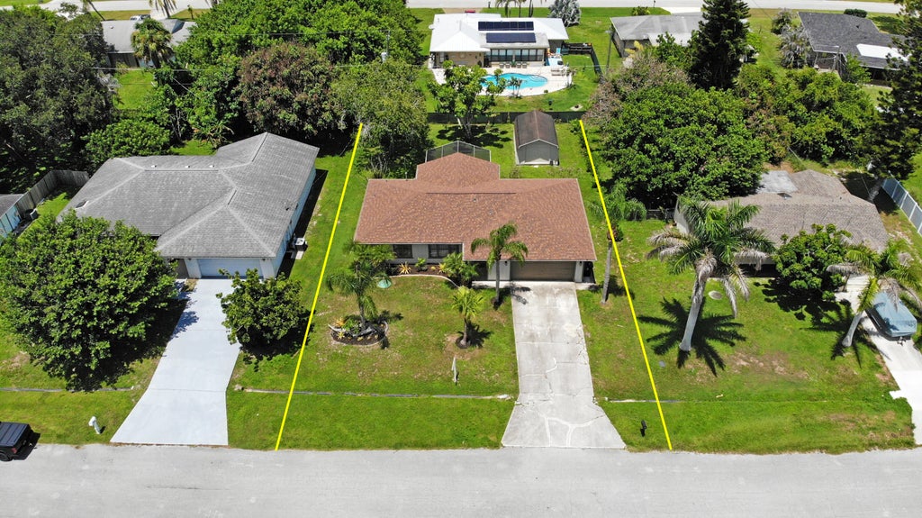 Photo of 471 SE Lancaster Avenue, Port Saint Lucie, FL 34984 (MLS # B26064254)