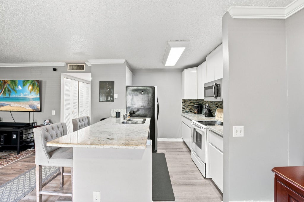 Photo of 711 FOREST CLUB Drive #119, Wellington, FL 33414 (MLS # B26069784)