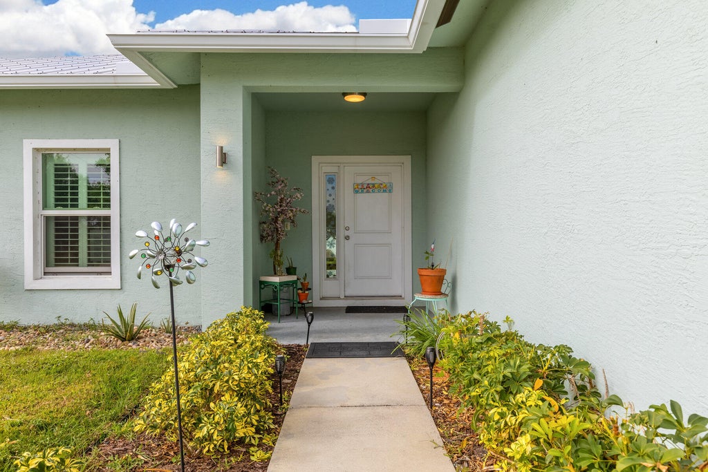 Photo of 4066 SW Port St Lucie Boulevard, Port Saint Lucie, FL 34953 (MLS # R11050398)