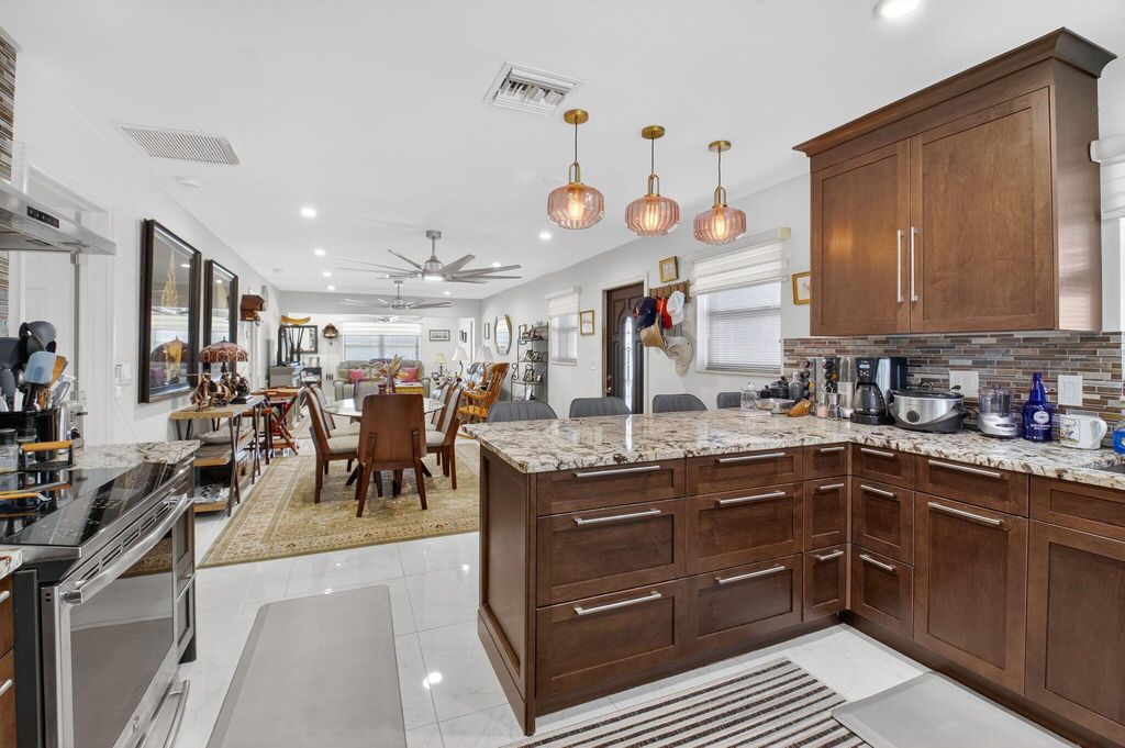 Photo of 737 Whippoorwill Lane, Delray Beach, FL 33445 (MLS # R11131853)