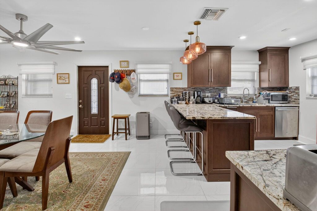 Photo of 737 Whippoorwill Lane, Delray Beach, FL 33445 (MLS # R11131853)