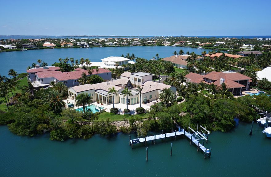 This magnificent waterfront home is situated on an island within the private Sailfish Point inner harbor.  Sailfish Point's unique location directly on the Atlantic Ocean and St. Lucie Inlet at the Southern tip of Hutchinson Island, makes it a community like no other. Residents enjoy five miles of pristine shoreline, oceanfront Jack Nicklaus ''Signature'' golf, elegant beachfront country club and full-service marina with immediate ocean access. Resort-style amenities include state-of-the-art fitness complex, spa/salon, Har-Tru tennis courts and the ultimate in private security. Sq Ft Per Floor Plan