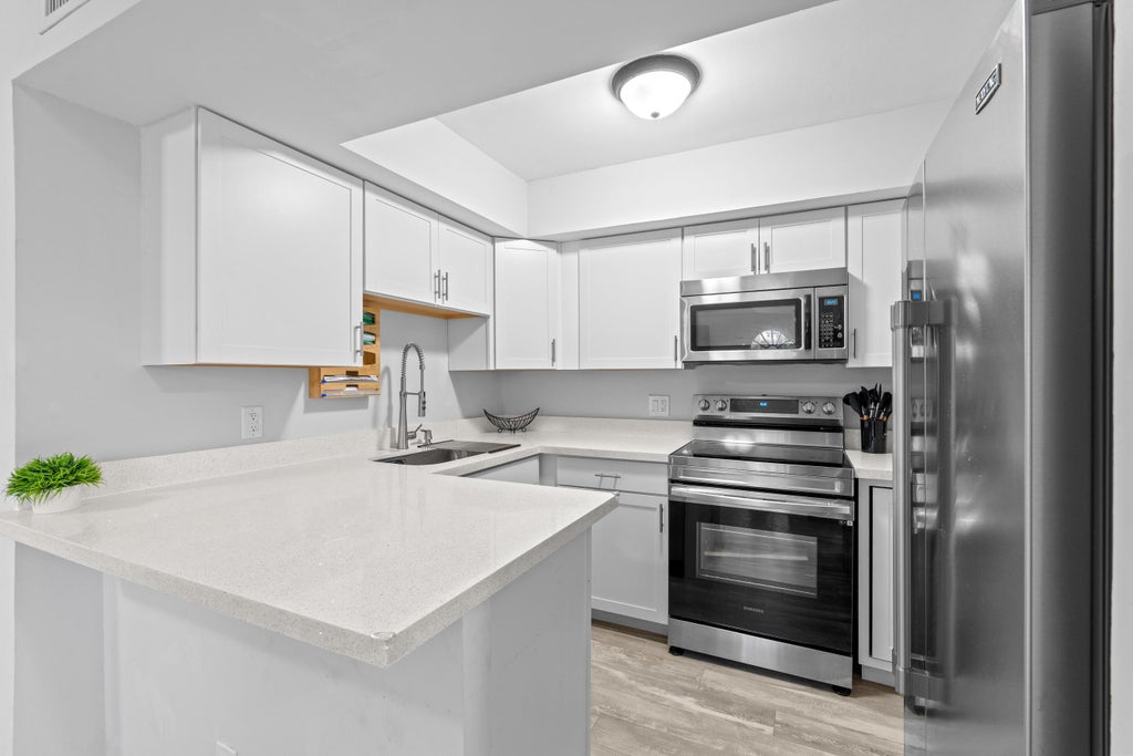 Photo of 3715 Village Drive #A, Delray Beach, FL 33445 (MLS # R11056802)