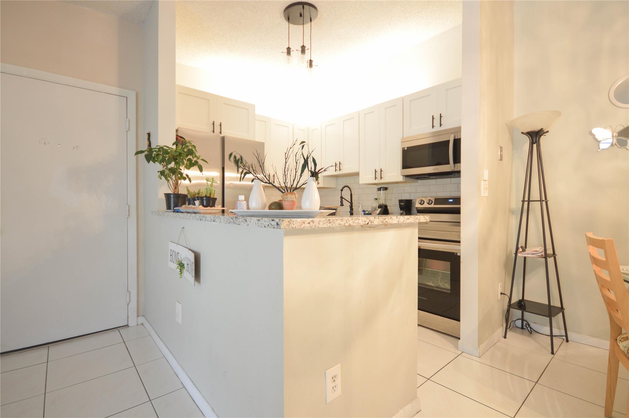 TAMARAC GARDENS CONDOMINI - Residential Lease