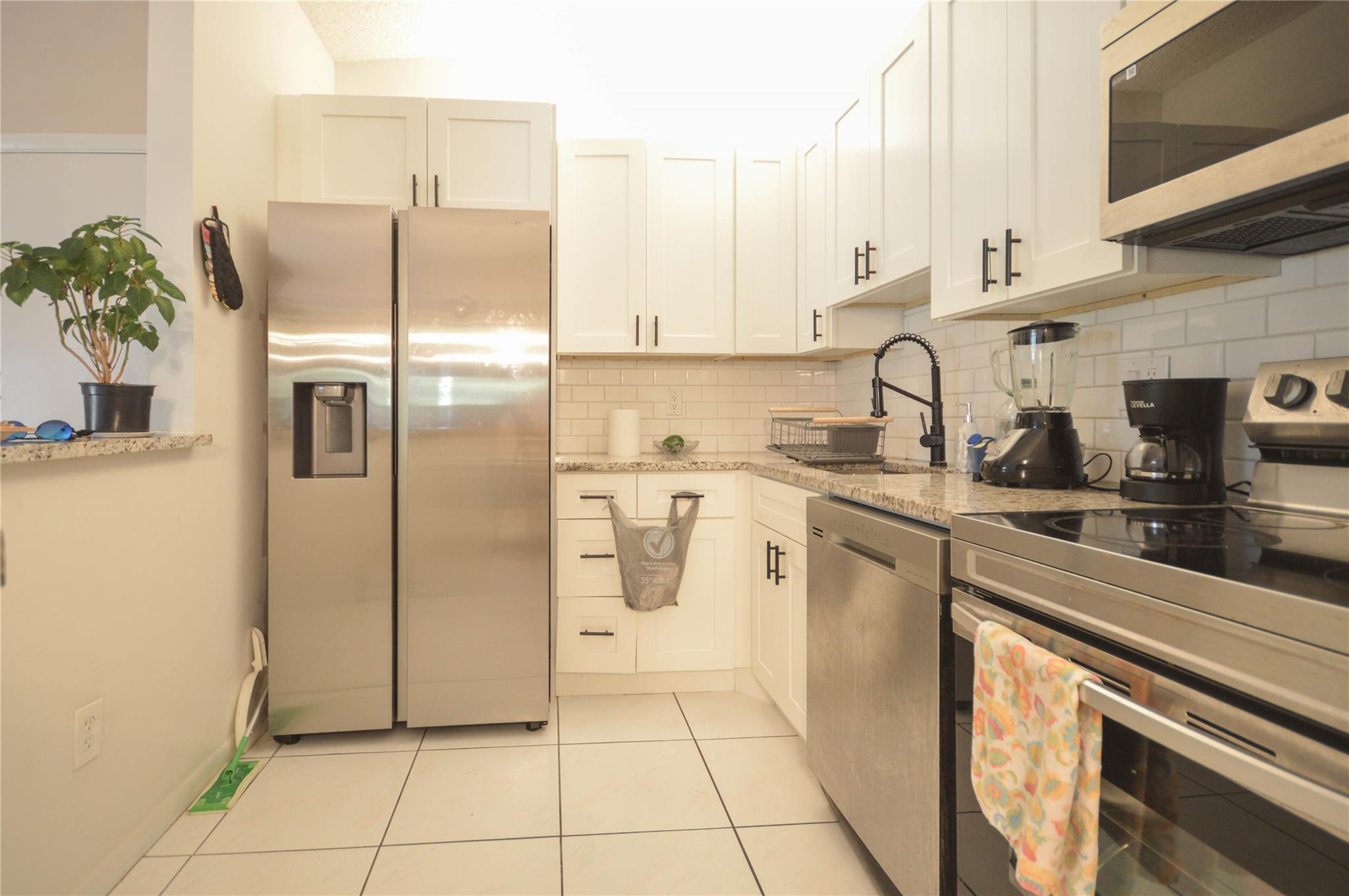 TAMARAC GARDENS CONDOMINI - Residential Lease