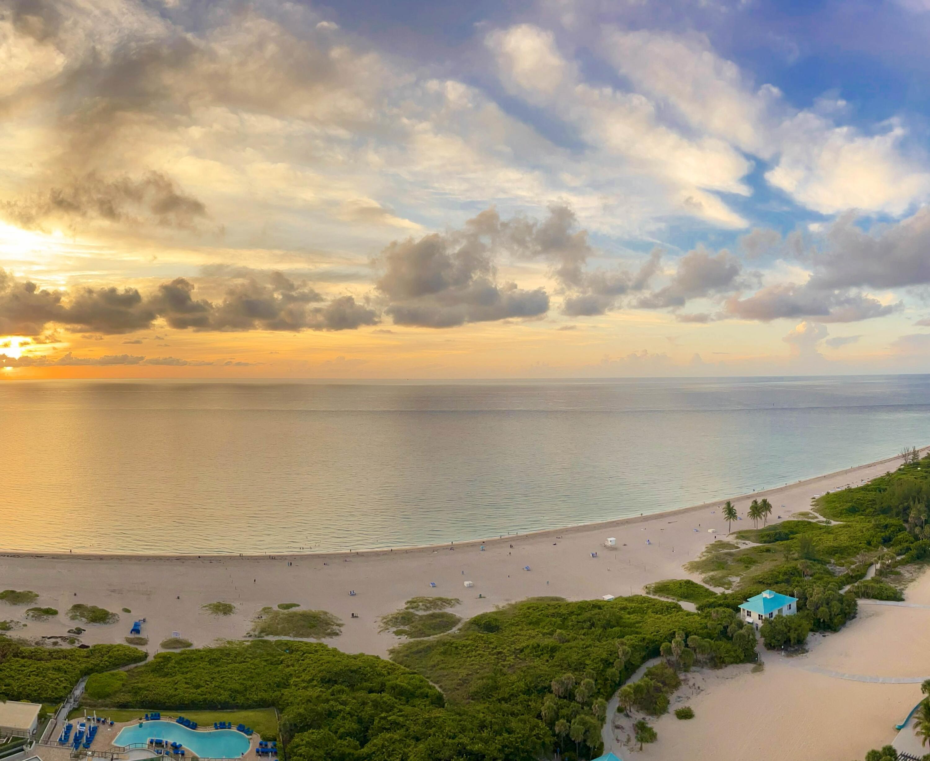 Experience refined coastal living in this elegant two bedroom plus den, two and a half bath residence at The Ritz-Carlton Residences, set on 8.8 acres along Palm Beach's pristine shoreline. This high-floor home offers sweeping views of the Atlantic, Palm Beach Island, and the West Palm Beach skyline. Features include a spacious oceanfront terrace, limestone flooring, drop ceiling panel lighting, in-ceiling speakers, electric shades, and a flexible den with pocket doors. Light, neutral tones enhance the serene ambiance. Enjoy world-class amenitiesa''two pools, huge private beach, restaurant and bar, theaters, fitness centers, and many social spacesa''plus two assigned parking spaces and the legendary Ritz-Carlton service.