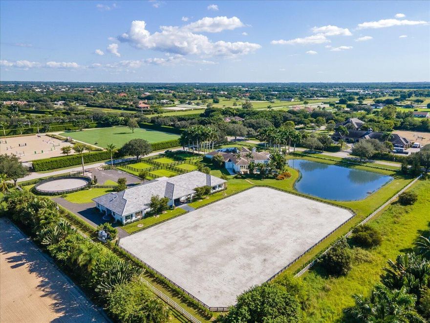 Fully renovated with top of the line finishes. Home features 4 bedroom, 4.5 bathrooms within in the coveted Palm Beach Point community. A Just finished 12 stall barn completed in 2021 featuring 6 paddocks, a round pen and groom's apartment.