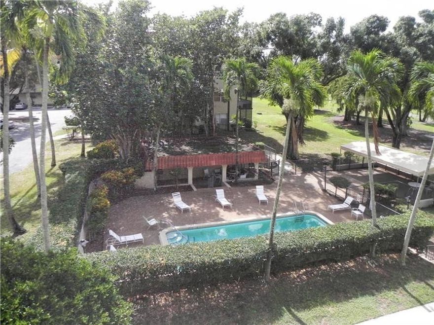 All ages welcome. Freshly painted, professionally cleaned & Move-in ready. Spacious 1 bed 2 bath in gated community with expansive walking/jogging paths directly across from building, bike trails, extra storage, golf & driving range. Large walk-in & linen closet offer plenty of storage. heated pool, laundry on each floor, 2 security gates, 24hr surveillance and assigned parking. NEW A/C  September 2021. NEW Hot Water Heater June 2022. Screened balcony with pool and garden views. Conveniently located near Sawgrass Mills & 20 minutes from the beach!  Maintenance includes water, sewer, trash, pest control, internet & cable with HBO/Showtime. Condo association requires credit score min of 675, yearly gross income min 45k, (6) months maintenance deposit.  OK to lease after 1st year.  CASH ONLY