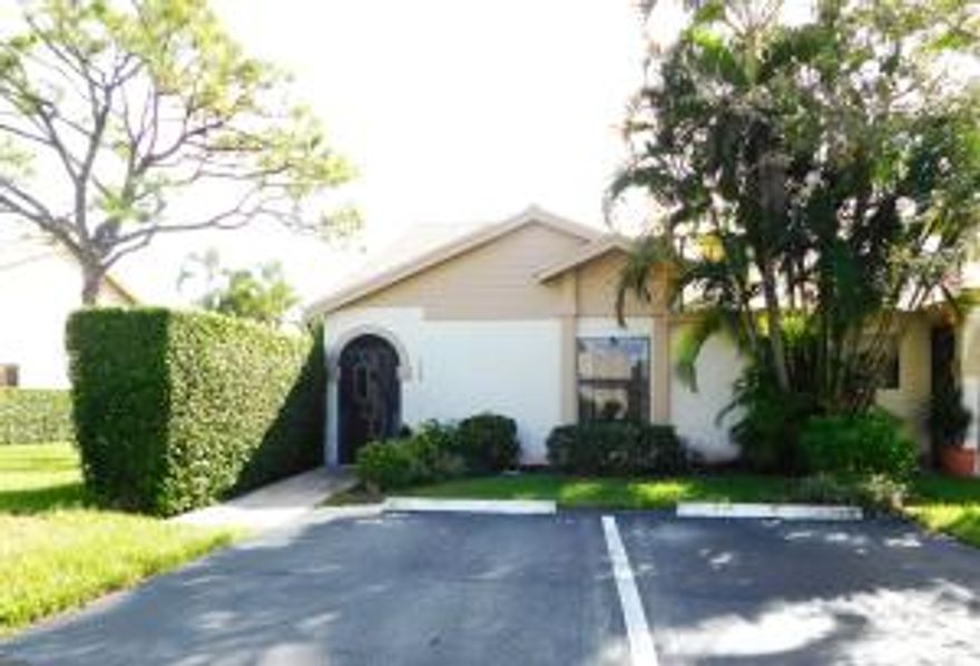 Rarely available, in great condition, this end unit villa may be what you are looking for. The vaulted ceiling and  enclosed Florida room makes this home open and spacious. Split bedroom plan, the master bedroom has 2 closets; one of them a large walk-in closet. The master bath has shower stall and 2nd bath has a tub. Eat-in kitchen, with new counter top & sink, extra storage, private, open patio also add to the comfort of this home. The A/C was replaced in 2014. The bedrooms have brand new carpet. The community offers 12 har-tru tennis courts, 5 swimming pools, bocce ball & shuffle board courts, its own theater. The clubhouse has a gym, library, billiard & card rooms, sauna, steam room, media center. Join lots of classes & activities. Walk or bike along a beautiful lake.