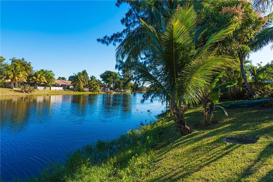 Don't miss out! This charming, spacious 2-Bedroom / 2-Full Bath Lakefront 1-story Villa is a hidden gem. Enjoy the Tropical Landscaped, Fenced Yard, perfect for the family and pets. Villa is ideal as a Primary Home or Vacation Home close to Beaches. No rental restrictions. Private entrance with oversized driveway for 2 cars overnight, room for 4 vehicles. Foyer Entrance, pantry closet with spacious, well-appointed Kitchen with breakfast area. Spacious Dining Room/Family Room/Primary Bedroom, all with beautiful Lake views.  Canoe on the Lake, launch from yard. Add Dock-deck area. Walk to Club House, Swimming Pool, Gym, Basketball / Tennis Courts. Conveniently close to stores, restaurants, all major highways; 25 minutes to Fort Lauderdale International Airport.  * HURRY * This won't last!