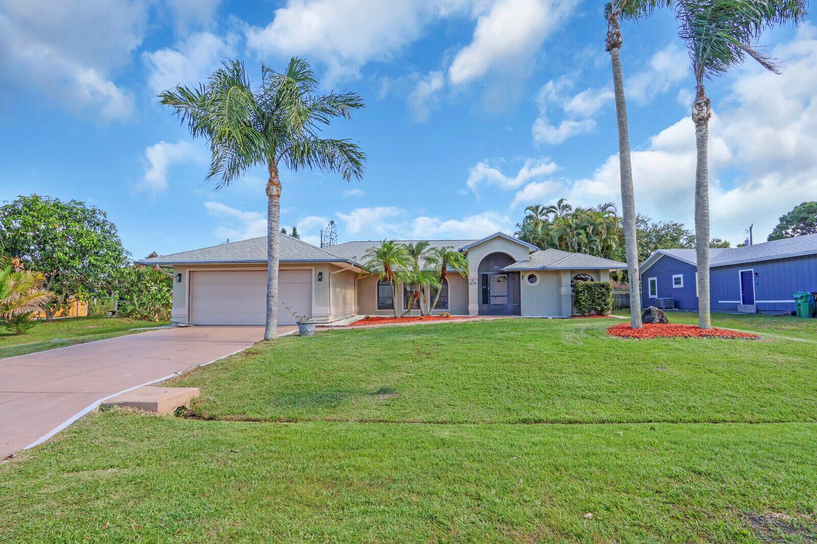 Welcome to this light and bright CBS single-family pool home in the heart of highly desirable East Port St. Lucie! Freshly painted throughout the interior and featuring recently renovated bathroom vanities, this home blends comfort and style with a touch of coastal charm.The open-concept layout is flooded with natural light thanks to large windows throughout. The spacious gourmet kitchen is a chef's dream, complete with rich wood cabinetry, granite countertops, stainless steel appliances, a propane gas stove, and breakfast bar seating--perfect for both everyday living and entertaining. (SEE MORE)