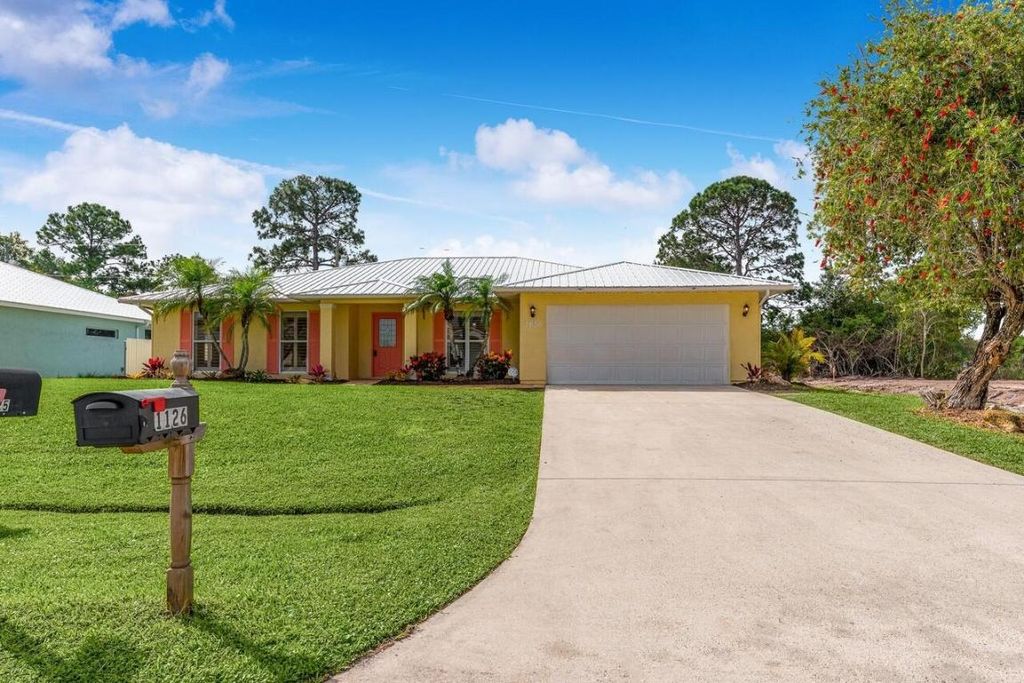 Photo of 1126 SW Calmar Avenue, Port Saint Lucie, FL 34953 (MLS # R11151552)