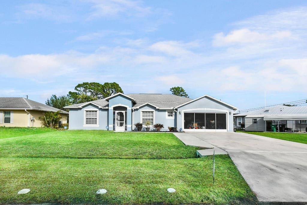 Photo of 1973 SW Sylvester Lane, Port Saint Lucie, FL 34984 (MLS # F10481313)