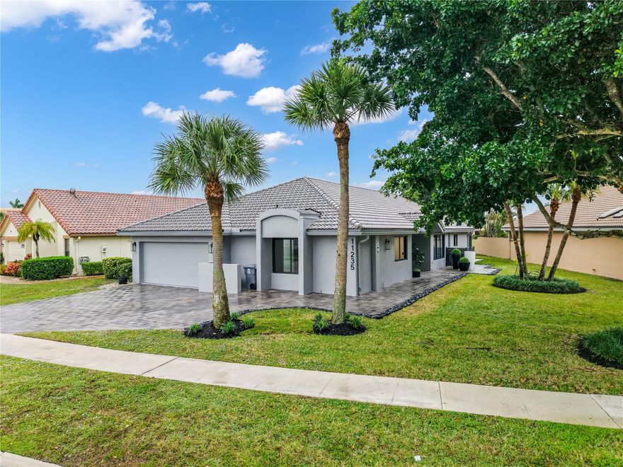 Discover an exceptional three bedroom, two bath plus office residence fully renovated with high end finishes. Stunning home has been redesigned featuring impact windows and doors, designer lighting and a modern open layout that exudes luxury and comfort. Kitchen features custom cabinetry, premium appliances, wine cooler and quartz countertops. The primary bedroom is a true retreat with a luxurious spa-style bathroom and a private office with a custom glass steel frame door. Upgrades include expanded driveway, epoxy flooring in the garage, smooth stucco on exterior of home, brand new washer and dryer and new duct work. BWCC offers two 18 championship golf courses, pickleball, tennis, fitness center, spa, game room, fine & casual dining & more. Mandatory membership $120,000. See attachments.