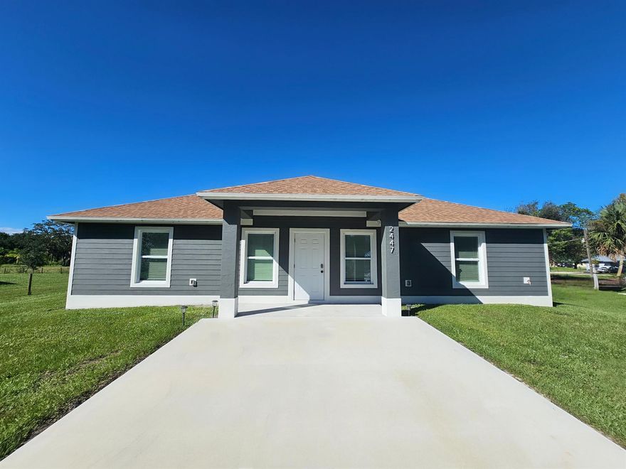 Newer Construction! Built in 2023, this beautifully designed CBS home offers 3 bedrooms, 2 bathrooms, and a spacious open-concept layout. The modern kitchen features sleek finishes and stainless steel appliances, complemented by elegant tile flooring throughout.The split-bedroom floor plan provides added privacy and comfort, while the screened back patio creates the perfect space to relax and enjoy the outdoors. Impact windows offer peace of mind and year-round comfort.Conveniently located just 2 miles from downtown Okeechobee, this home provides the ideal blend of quiet country living and easy access to city amenities.