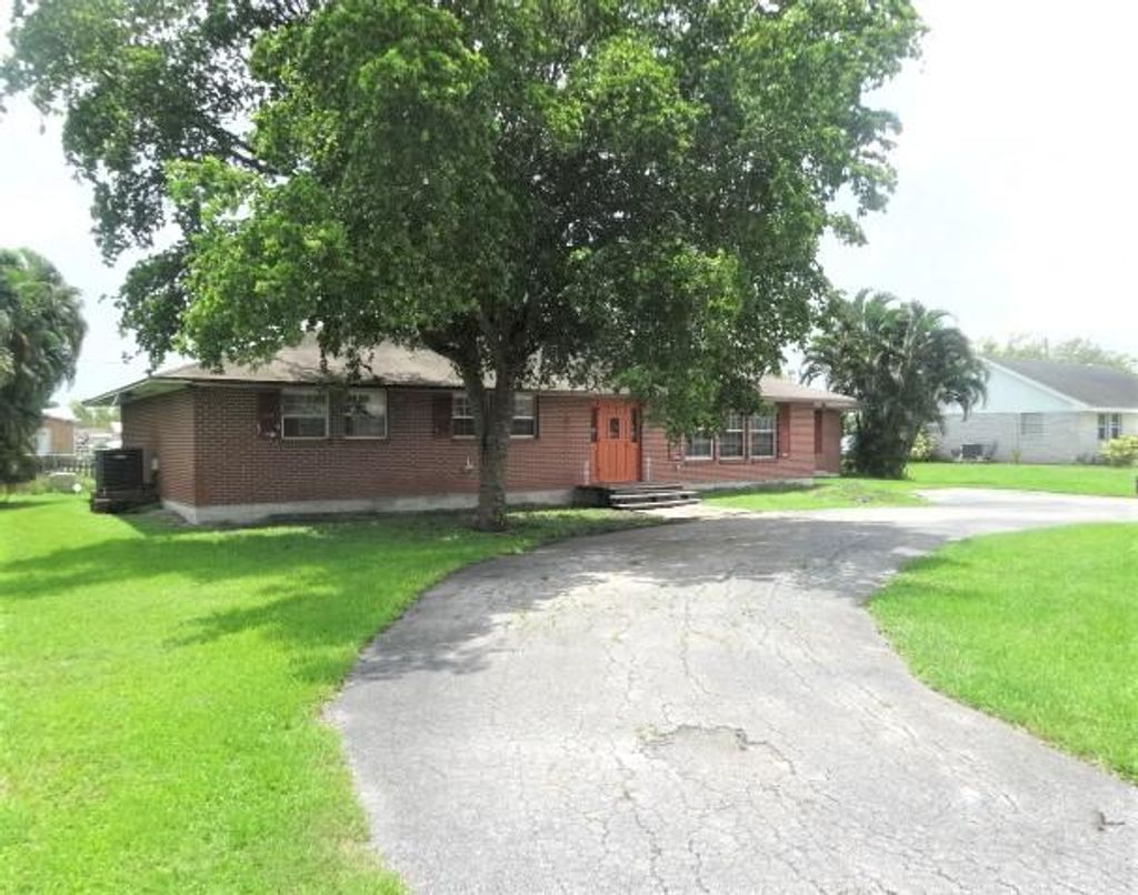 Photo of 765 S Main Street, Belle Glade, FL 33430 (MLS # R10979419)