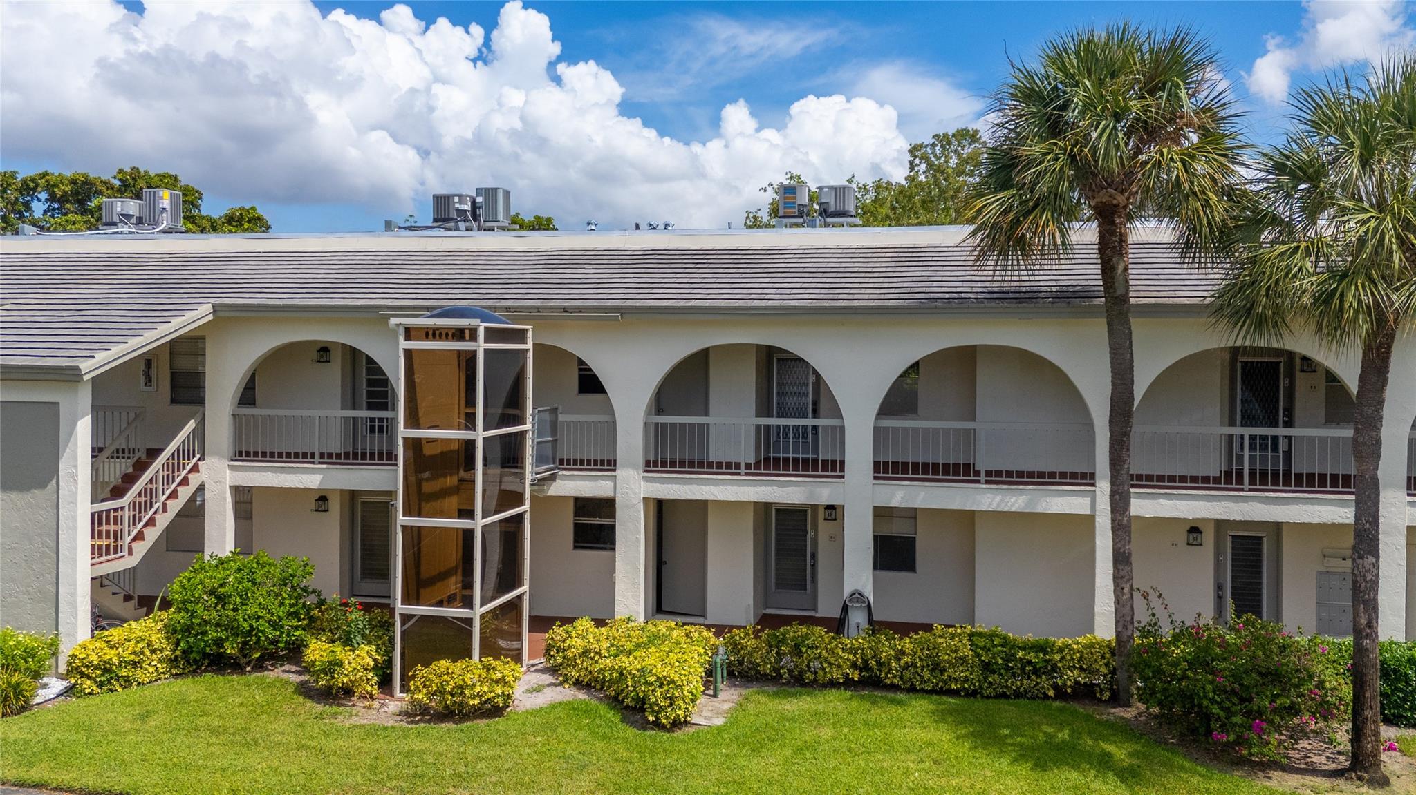 Welcome to this charming and spacious 2nd-floor condo located in a quiet two-story 16-unit building within the coveted 55+ Wynmoor community. Just steps away from the community center, this well-maintained residence offers peace, privacy, and an ideal layout. Featuring an oversized screened patio with hurricane shutters and sliding door access from main bedroom and living room. New elevator, New roof, and FREE laundry room just steps away. Amenities: gated security, golf course, pickleball, heated pool/spa, fitness center, BBQ area, café, movie & concert theater, clubs, bocce ball, car wash, and weekend activities. Low Taxes, Low HOA, High reserves, & NO assessments! Only 6 miles away from newly renovated Pompano Beach. This condo offers a perfect blend of value, location, and lifestyle.