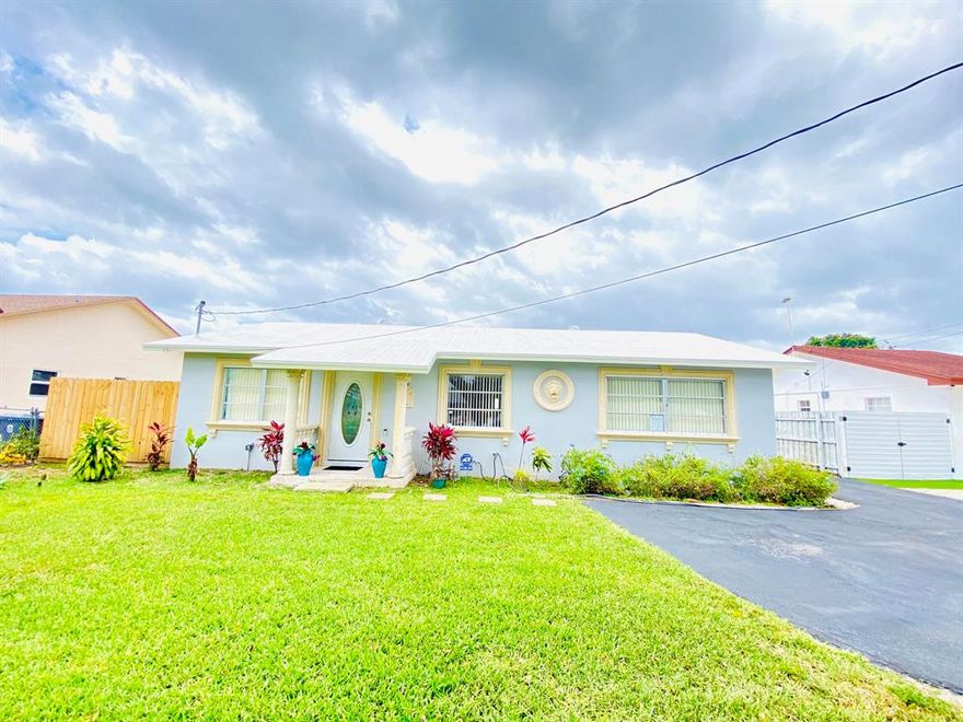 Well maintained property located in the heart of Lake Worth, only minutes from I-95, shopping centers and restaurants. The property sits on a large lot and has a detached garage/workshop with it's own bathroom. The house features tile floors, glass shower/tub doors, newer A/C and water heater, completely fenced backyard with plenty of room for a pool, hurricane shutters, and much more. You also have enough room to bring your RV, trailer, and boat. Don't miss the opportunity to call this lovely house your home.