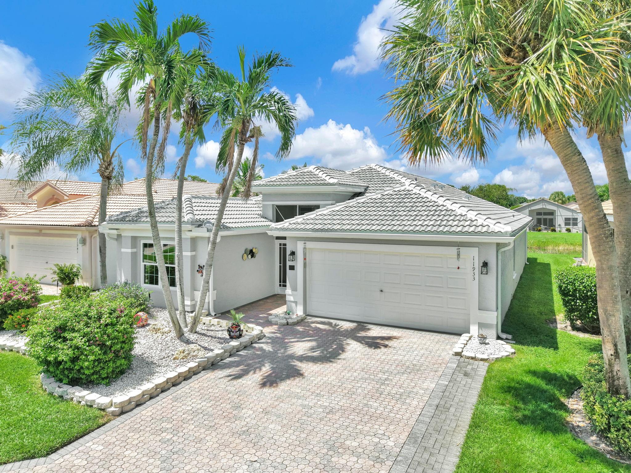 Immaculate model home with direct canal fountain view in Valencia Lakes. Original owners have meticulously maintained and upgraded: new tile roof (2024), central A/C (2019), water heater and range (2025). Full hurricane protection includes impact windows, accordion shutters, and clear panels—qualifies for insurance discounts. Great open floorplan with bright, neutral tones and tile/laminate throughout. Remodeled baths with custom tile, frameless glass doors, grab bars, and refaced cabinetry. Screened patio with tile floor, epoxy garage, built-in desk/storage, luxury window treatments. Furnishings available. Active 55+ community with clubhouse, resort-style pools, cafe (Pay $500 per year towards food due Feb) tennis, pickleball, fitness center, lifestyle director, and vibrant social scene.