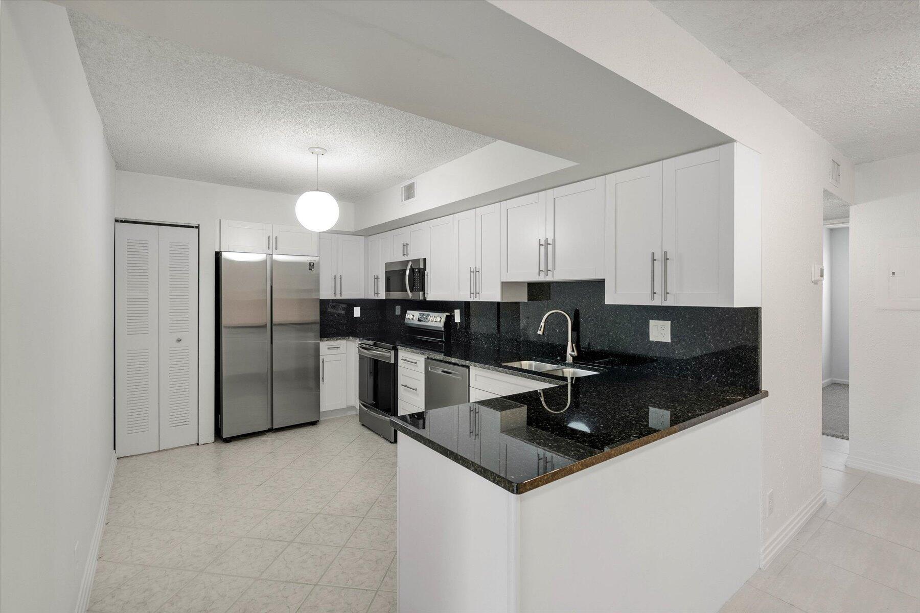 Stunning first-floor condo in the desirable gated community of Windwood, Boca Raton-24-hour security for peace of mind-Recently updated for modern living-Newly renovated kitchen with:-Granite countertops-Brand-new stainless steel appliances-New cabinetry-Master bedroom features:-Upgraded bathroom with zero-entry shower-New flooring and light fixtures-Convenient accordion shutters-Serene screened-in patio with views of:-Expansive natural lake-Hammock area-Add amenities:-Brand-new washer and dryer-Cable and water included-Community features:-Beautiful natural surroundings BBQ and picnic areas-Dog park-Two fishing piers-Kayaking,canoeing,and fishing allowed- Prime East Boca location,minutes from:-Beach- I-95-Mizner Park-Restaurants-Town Center Mall-FAU/Lynn University-Top public schools!