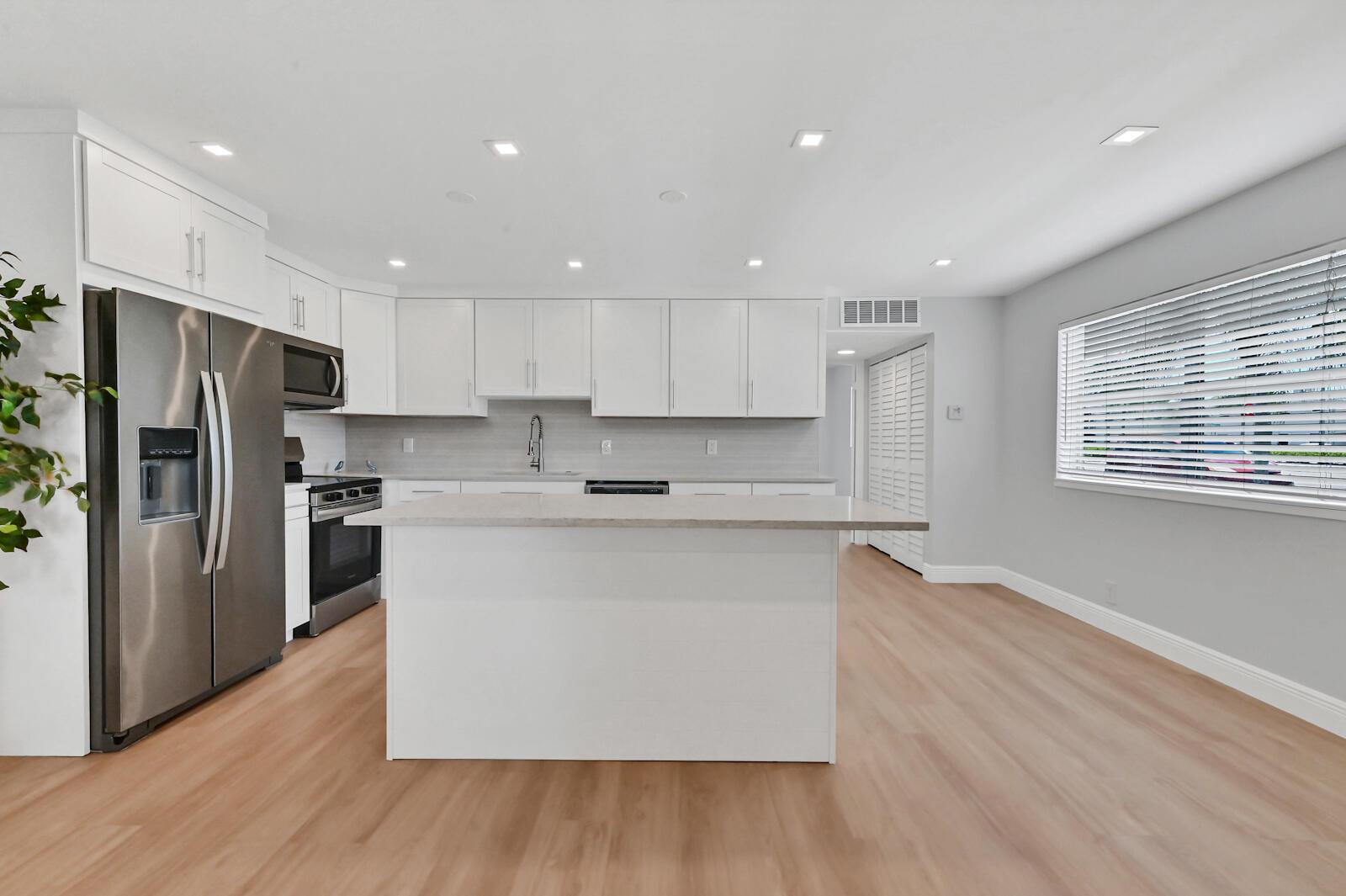 Modern, FullyRenovated CORNER Condo.This stunning, move-in-ready condo is just 150 yards from the Monaco Clubhouse and packed with high-end upgrades.Spacious open-concept kitchen with expansive center island,shaker cabinets to the ceiling,custom backsplash,and beautiful neutral finishes.Bright, fully renovated featuring new flooring throughout,energy-efficient recessed LED lighting throughout,,a new tankless water heater,new electric panel,sleek stainless-steel appliances with generous storage.Convenient parking is located right at your doorstep, with easy access to Jog road,and restaurants.Resort-style community amenities include heated pools, a gym, golf, tennis,restaurants, and a courtesy bus.Completely updated, perfectly located -- this is the one you've been waiting for!650 MIN CREDIT