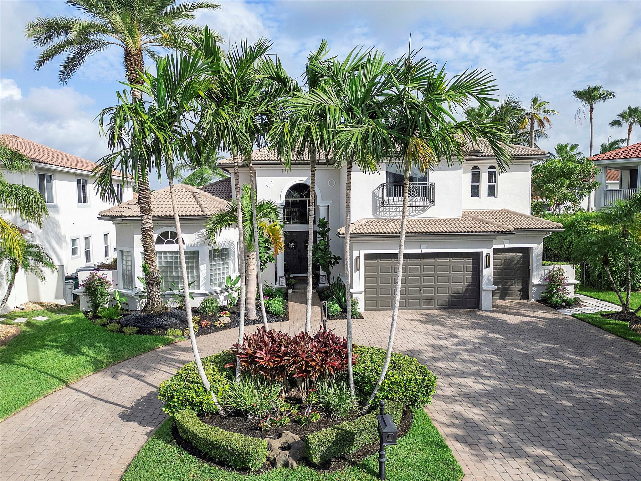 Welcome to this Impeccable 6BR/6BA modern-classic lakefront pool home in The Estates at Heron Bay. Perfect for multi-generational living, featuring a 1st-floor primary suite w/his & her walk-in closets, guest ensuite, & office/den ideal for working from home. Upgraded kitchen w/soft-close cabinets, Sub-Zero fridge, newer appliances, & large island. Upstairs offers spacious bedrooms, Jack & Jill bath, additional full bath, & large loft. Enjoy a private screened backyard oasis w/heated pool & spa. Extras: Nest thermostats, EV charger, custom entertainment console, shiplap panels, LED lighting, secret playroom, newer A/C. Resort-style amenities: 2 clubhouses, pools, new tennis/pickleball courts, gyms, racquetball, splash pad, playgrounds, trails & A+ schools.