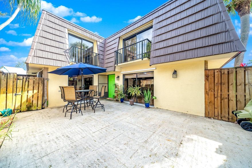 Rarely available townhome in the heart of Palm Beach Gardens! This spacious 2-bedroom, 2.5-bath residence features a large private courtyard perfect for outdoor living and entertaining. Both upstairs bedrooms are generously sized, each with its own full bathroom, one en-suite and the other conveniently located just outside the bedroom. Each bedroom also has its own private balcony, offering added charm and relaxation space. Downstairs features an open living area, a convenient half bath, and an in-unit washer and dryer thoughtfully tucked away.Located in a desirable community with a low HOA, this home is just minutes from shopping, dining, parks, and major highways. Don't miss the opportunity to own this well-maintained townhome in a prime location!