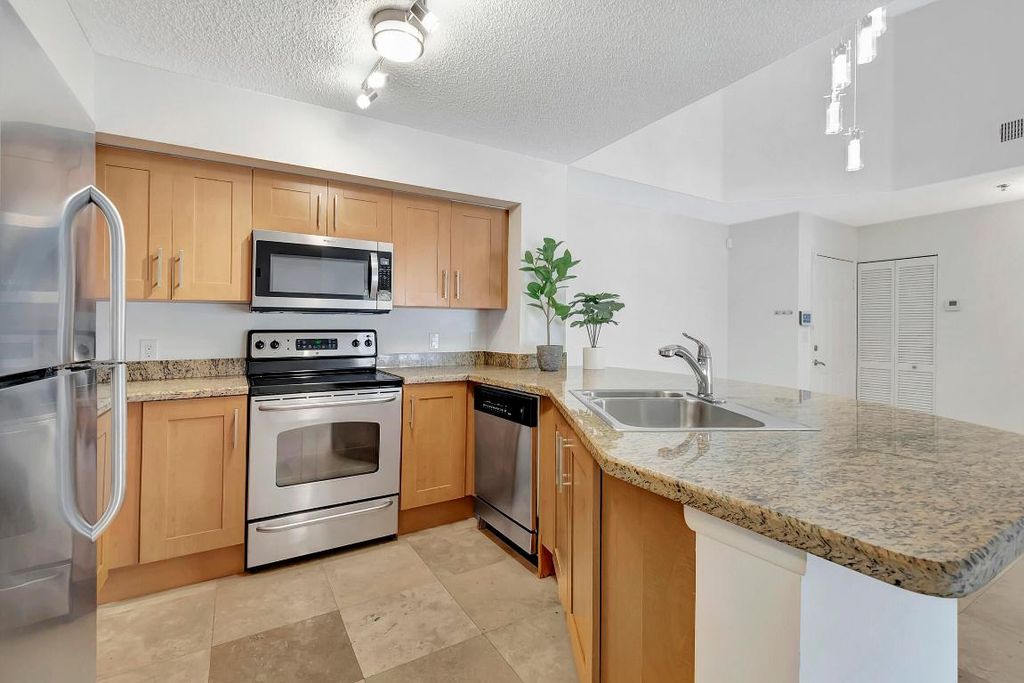 Photo of 3111 Clint Moore Road #203, Boca Raton, FL 33496 (MLS # R10962859)